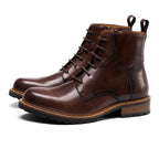 Brown leather lace-up ankle boots with pointed toe, contrast stitching and rubber sole