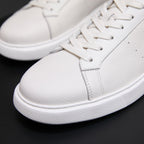 White genuine leather sneaker toe and side, lace-up with grippy rubber platform sole