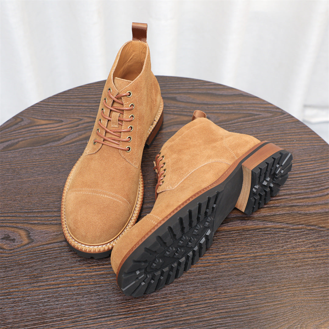 Men's tan chukka boots shown from side with lace-up and textured outsole
