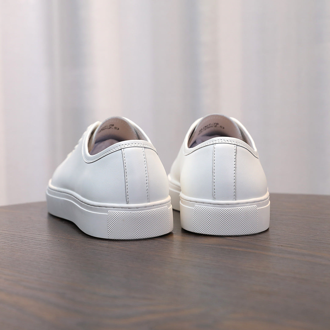 Men's leather sneakers, white back view with rubber sole and heel panel.