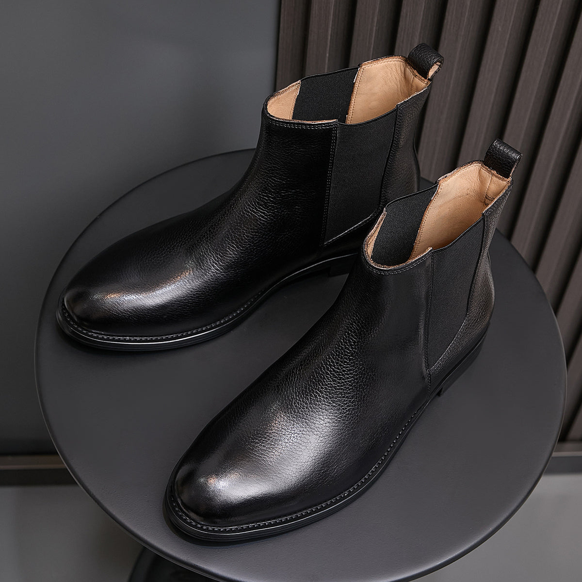 Pointed-toe Chelsea boots, black, side angle with elastic gore and short heel