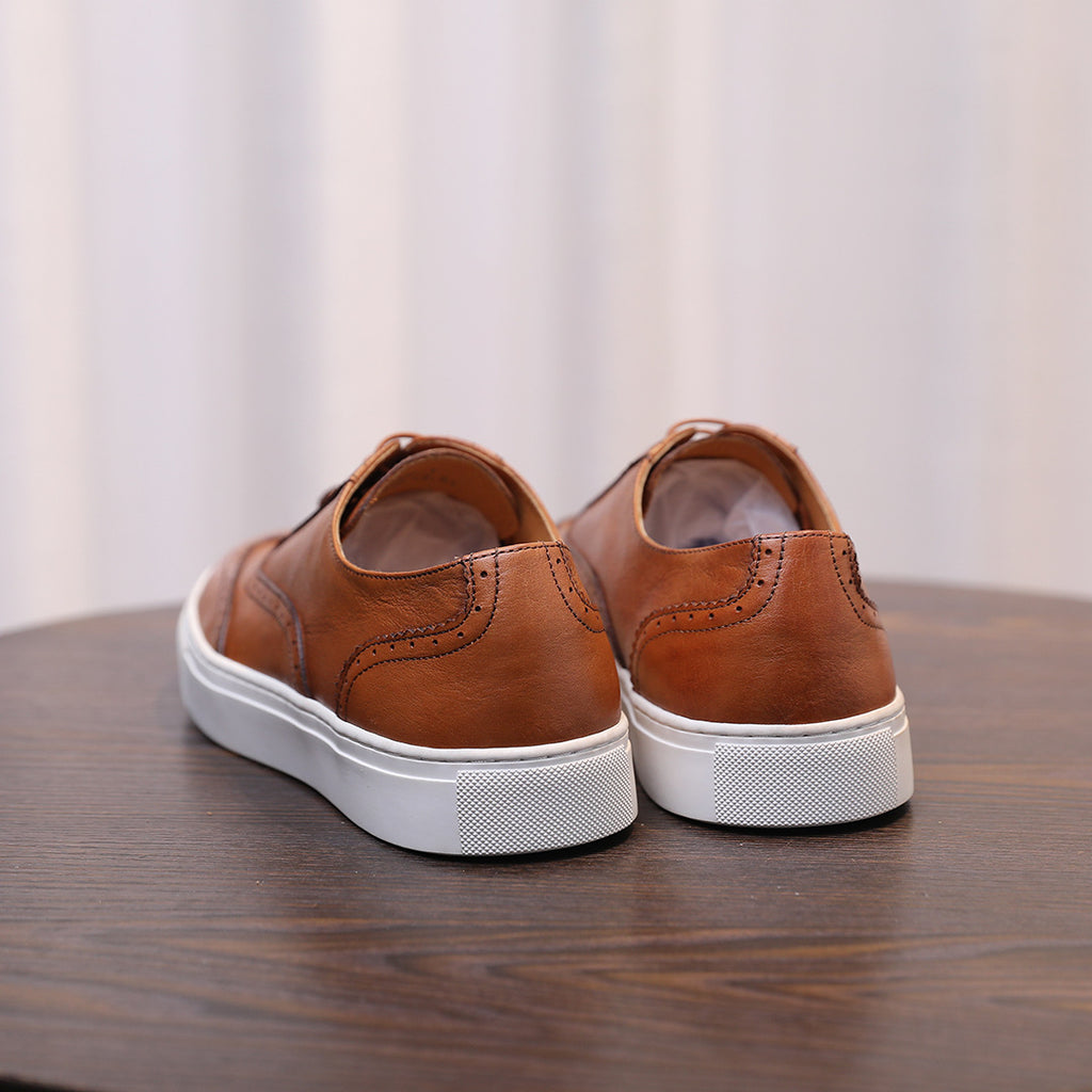 Men's brown leather sneakers back view with white rubber sole and heel panel