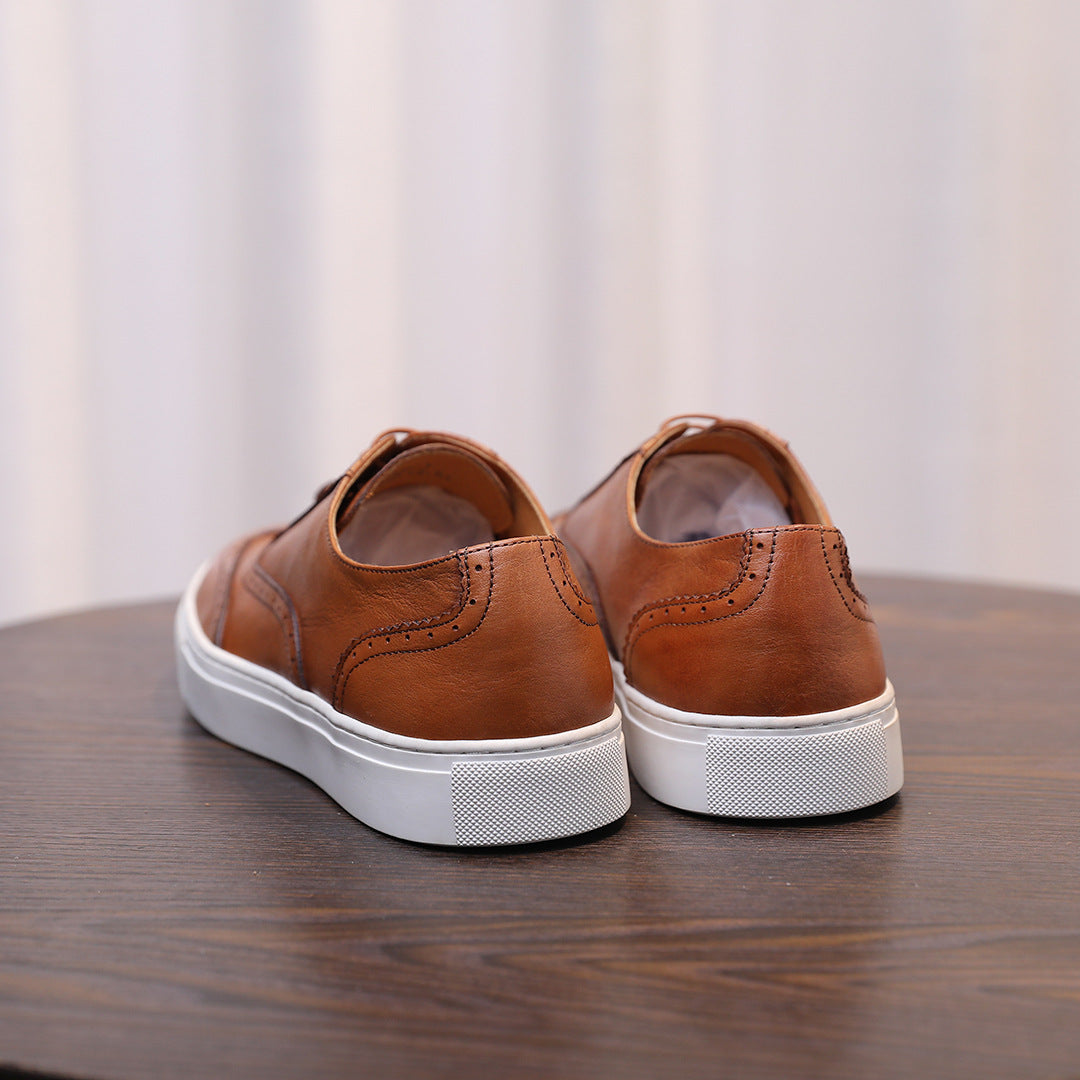 Men's brown leather sneakers back view with white rubber sole and heel panel