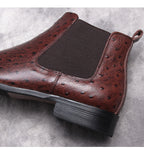 Dark brown leather Chelsea boot with elastic gore and perforated texture
