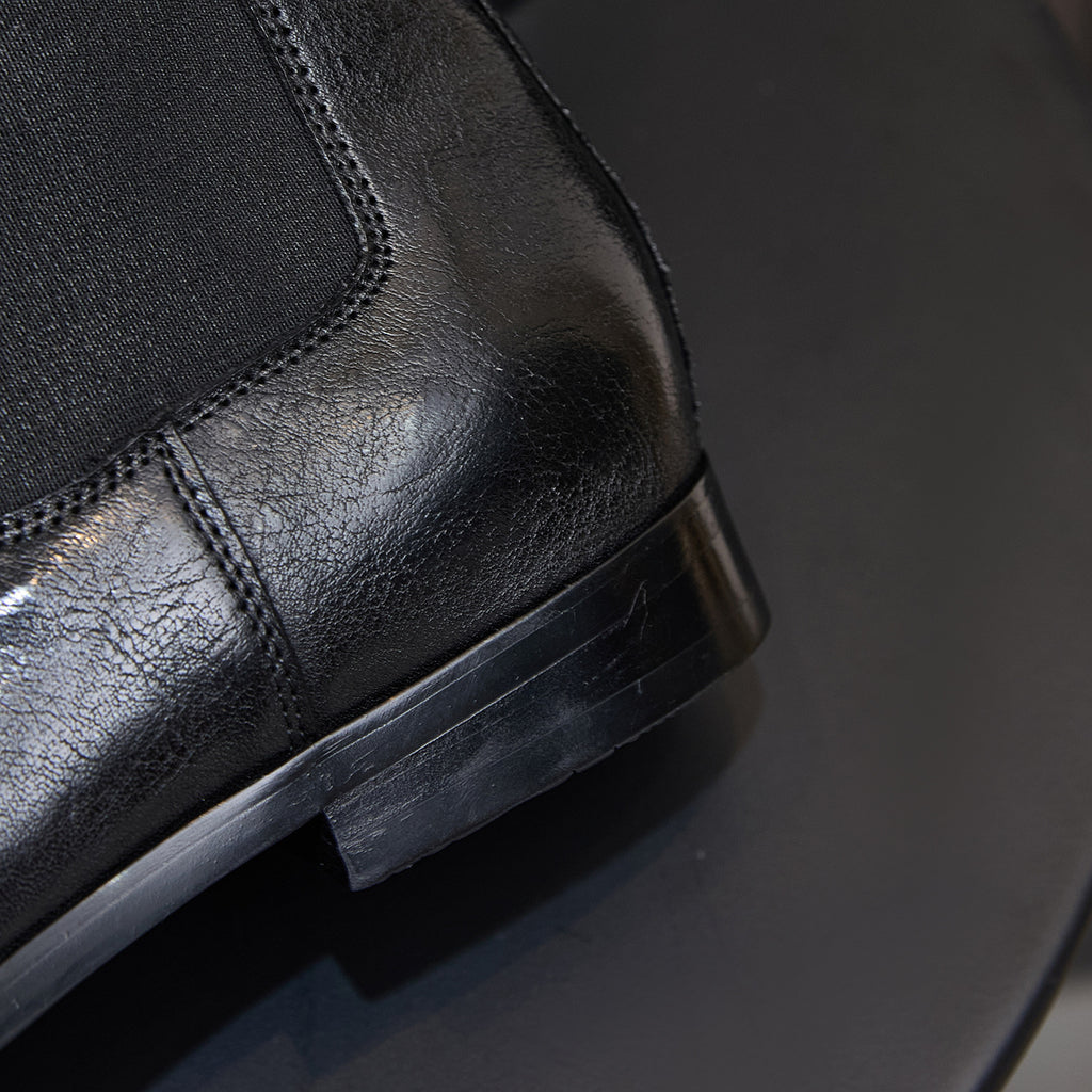 Black Chelsea boot with elastic gore and side pull tab, low stacked heel