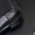 Black Chelsea boot with elastic gore and side pull tab, low stacked heel