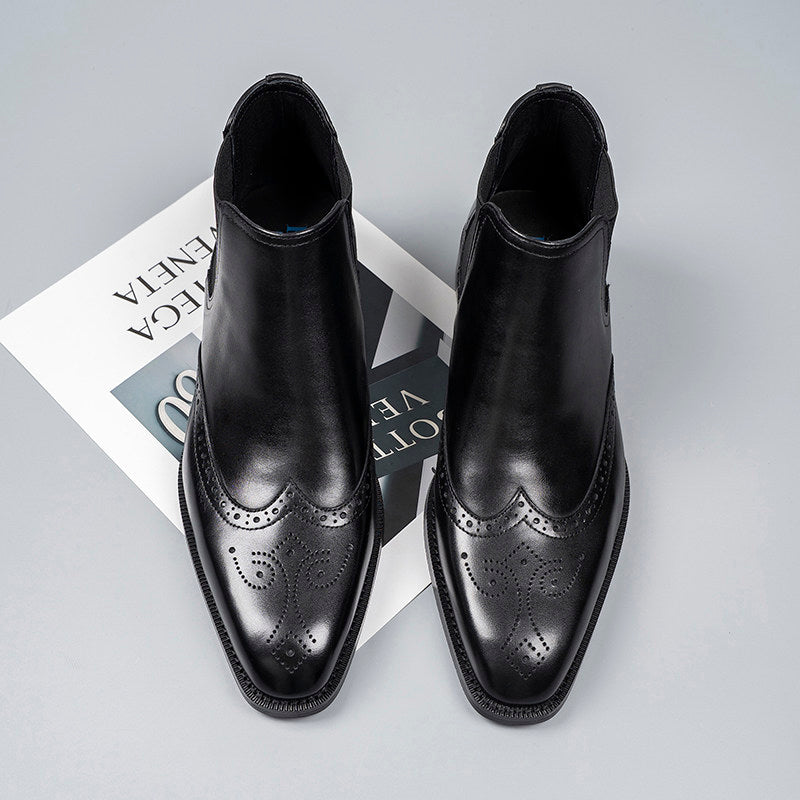Black leather Chelsea dress boots with elastic gore and perforated wingtip styling
