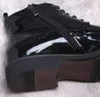 Men's black dress boots close-up: side zipper and thick sole