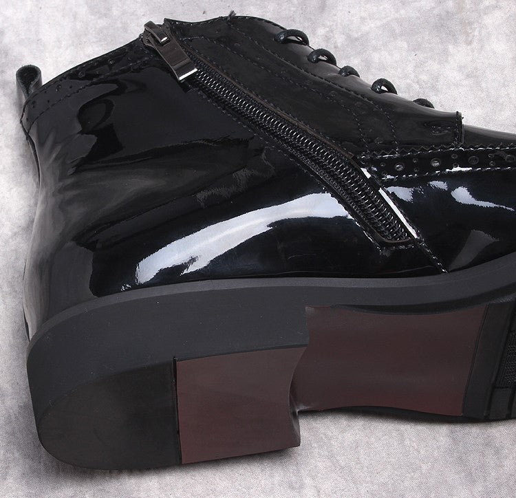 Men's black dress boots close-up: side zipper and thick sole