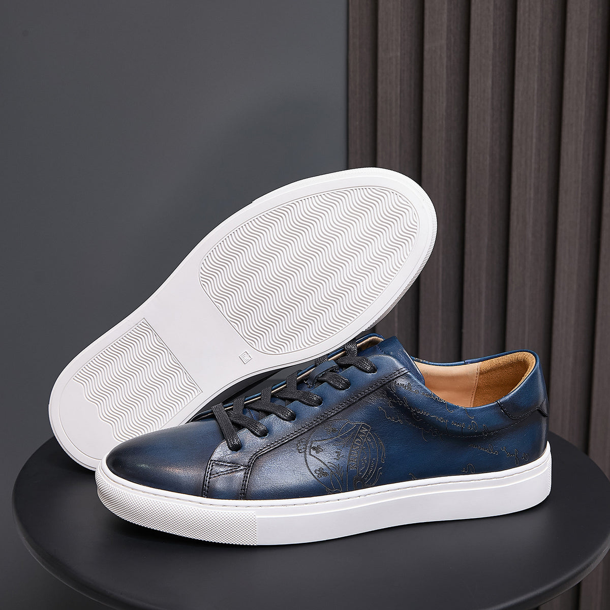 Navy leather sneaker outsole with textured tread, shown with white sole edge