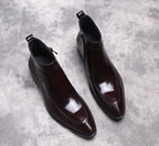 Black leather side-zip dress boots with thick sole and pointed toe