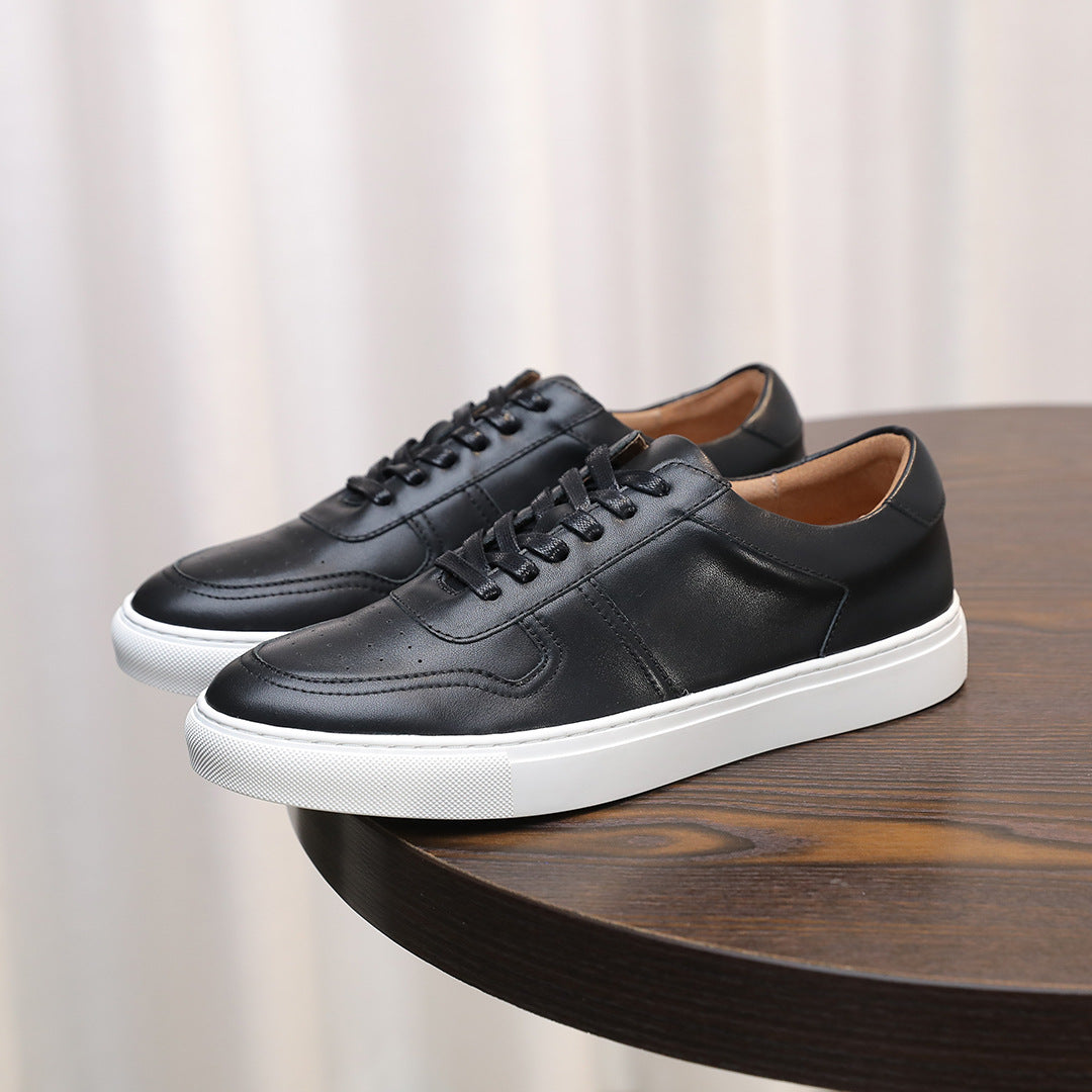 Black men's leather sneakers with lace-up front and white rubber midsole