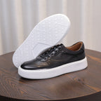 Black leather lace-up sneaker with textured tread sole and white outsole