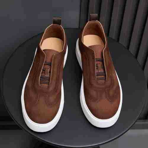 Brown leather sneakers, slip-on style with textured upper and white sole