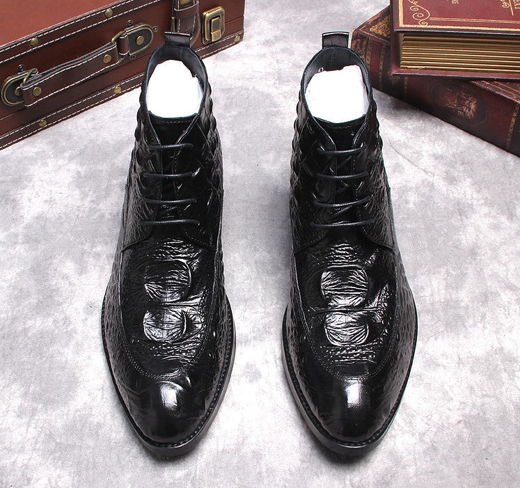 Black lace-up dress boots, front view with wingtip stitching and shiny leather finish