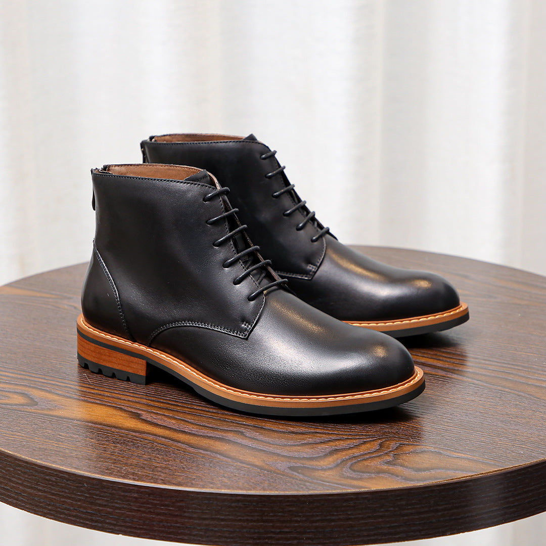 Black leather lace-up ankle boots with orange edge welt and stitched panels