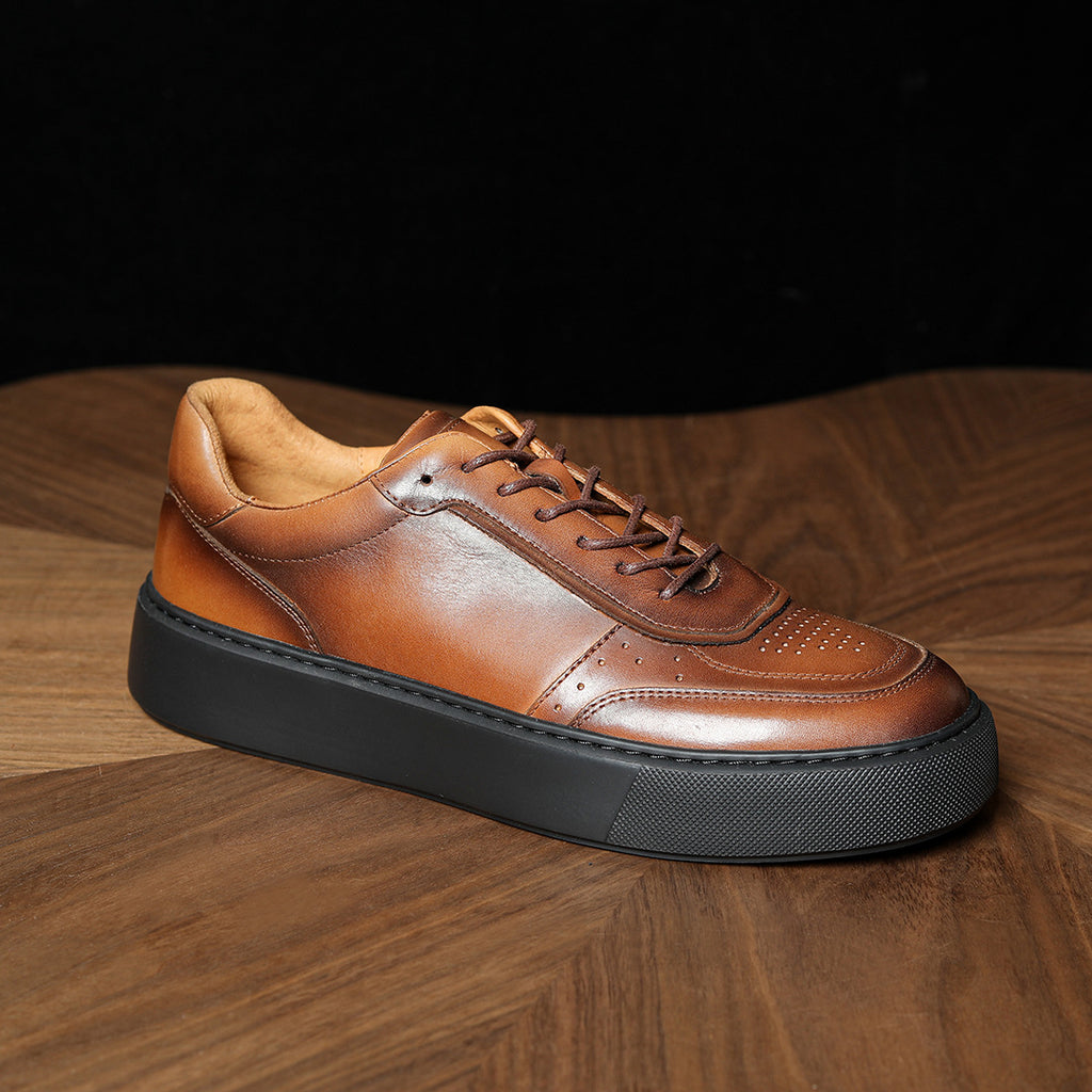 Brown genuine leather sneakers with lace-up front and thick dark rubber sole