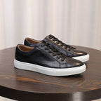 Black leather lace-up sneakers with low profile and white sidewall sole