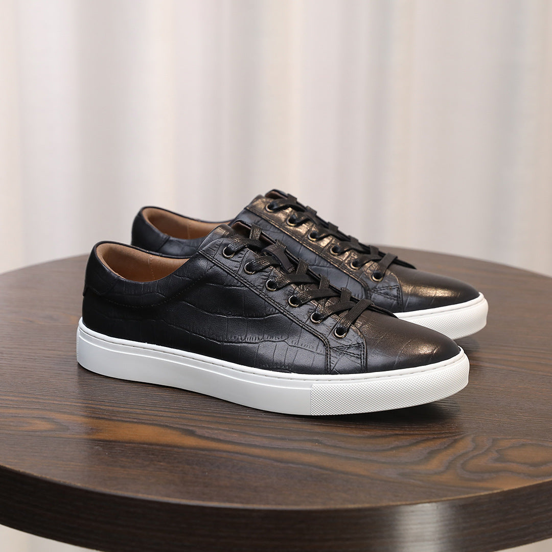 Black leather lace-up sneakers with low profile and white sidewall sole