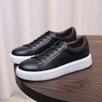 Men's leather sneakers, black, lace-up low-top with white rubber sole edge