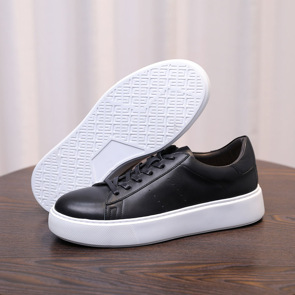 Men's black leather low-top sneakers with lace-up and white rubber sole