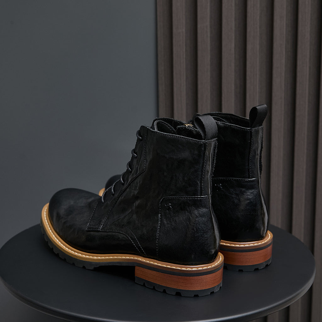 Men's black leather ankle boots with pointed toe, lace-up front, and side zip.