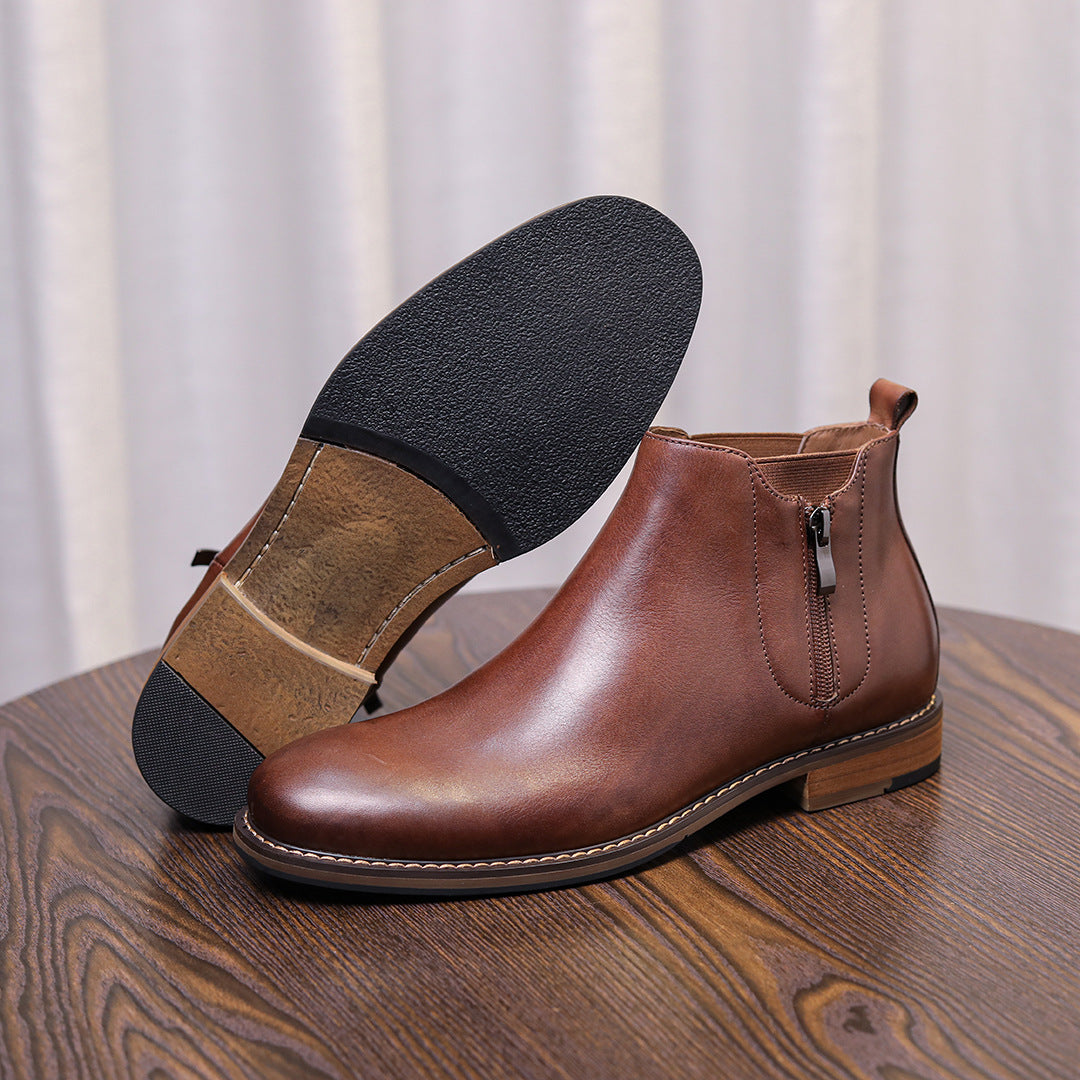Brown leather pointed-toe side-zip ankle boots shown with sole view.