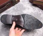 Black boot outsole with textured tread and patterned insole marked 38