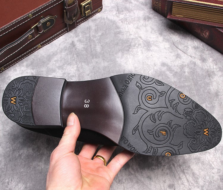 Black boot outsole with textured tread and patterned insole marked 38