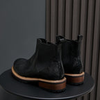 Men's black pointed-toe suede Chelsea boots, elastic side panels, tan welt sole trim