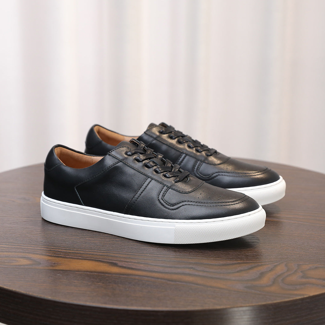 Black leather sneakers, three-quarter view, lace-up with stitched panels and sole