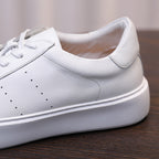 Men's white leather sneaker, smooth side panel with stitching and lace collar