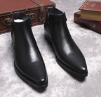 Black leather side-zip dress boots, thick sole and sleek pointed toe, pair view.