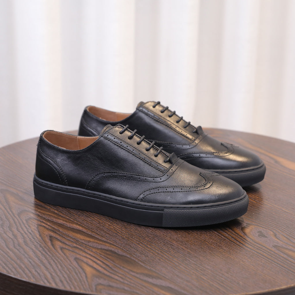 Men's black leather casual sneakers with lace-up closure and low white sole edge