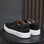 Men's dark green leather low-top sneakers with lace-up design and white platform sole