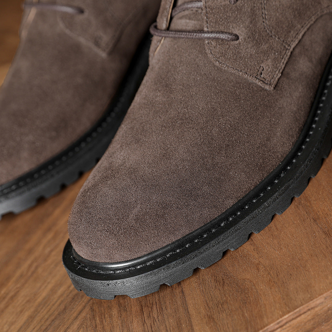 Men's dark brown chukka boots with plain toe and black rubber sole edge trim