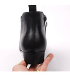 Black leather ankle dress boot rear view with block heel