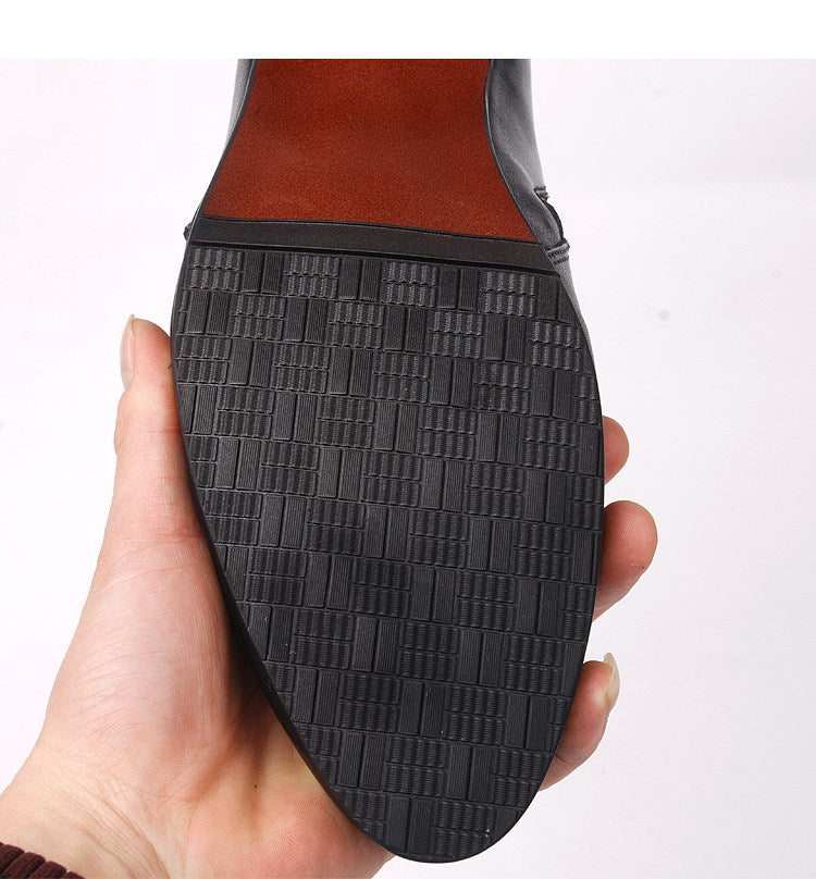 Black boot outsole with textured brick-pattern tread