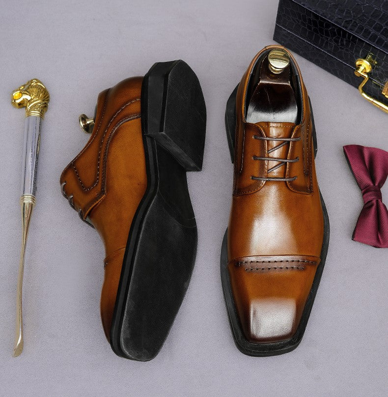 Men's brown leather lace-up derby dress shoes with pointed toe and black heel detail.