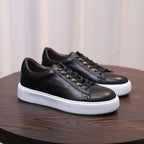 Men's black leather low-top sneakers with lace-up and white rubber sole