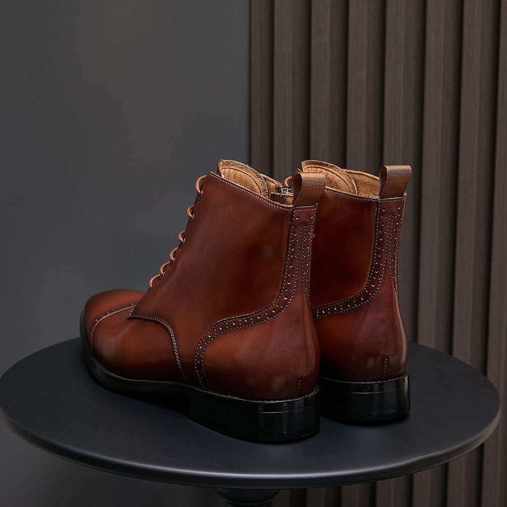 Men's brown leather dress boots with pointed toe, lace-up front, and back pull tabs