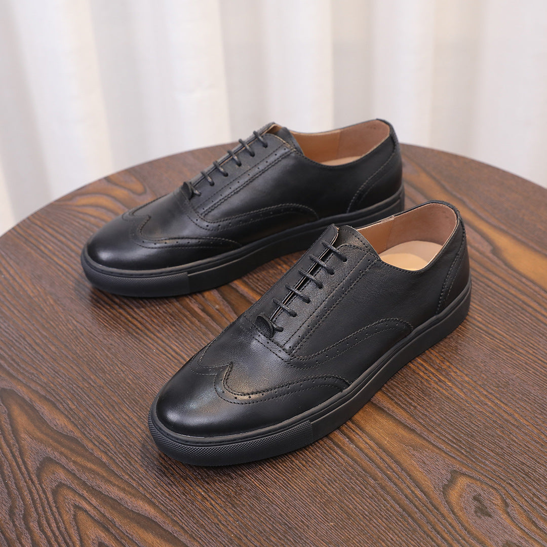 Men's black leather sneakers with lace-up front and minimal stitching