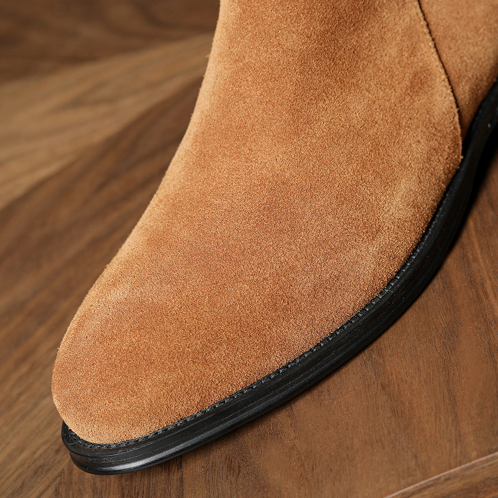 Men's pointed-toe leather side-zip dress boots, close-up of brown suede toe and sole