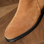 Men's pointed-toe leather side-zip dress boots, close-up of brown suede toe and sole