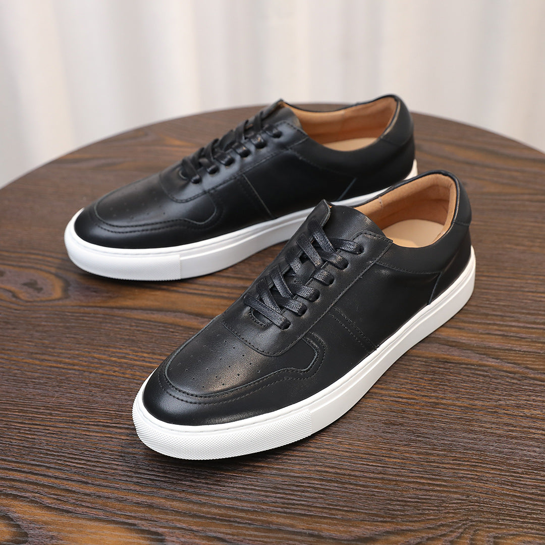 Men's black leather lace-up sneakers with white rubber sole and minimal stitching