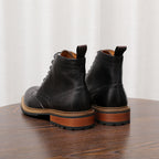 Black leather lace-up chukka boots with heel view and lace closure