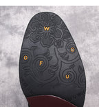Shoe outsole tread with decorative pattern and colored traction icons