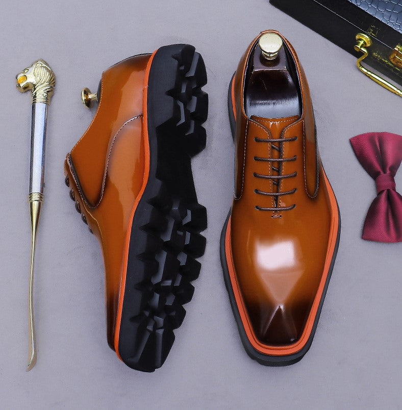 Men's brown wingtip brogue oxford shoes, side and top view, chunky lug sole