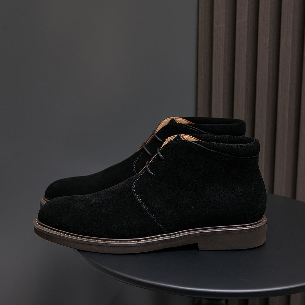 Men's black suede chukka boots with lace-up closure, plain toe, and rubber sole