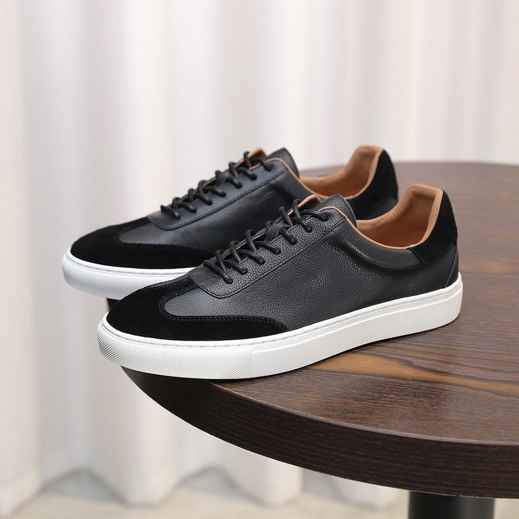 Men's black leather lace-up sneakers with low profile and white rubber midsole